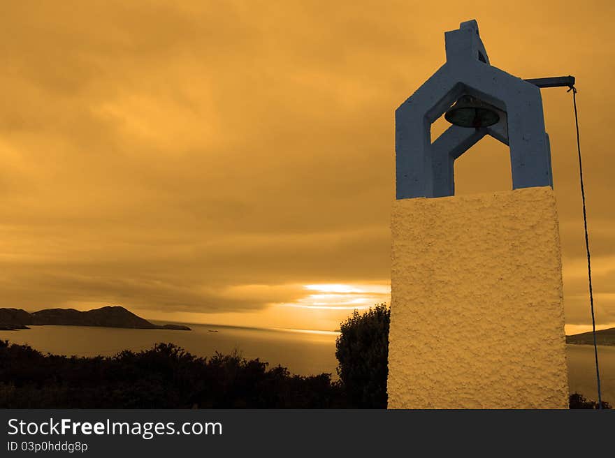 Bell tower at sunset with scenic view in kerry ireland of coastline