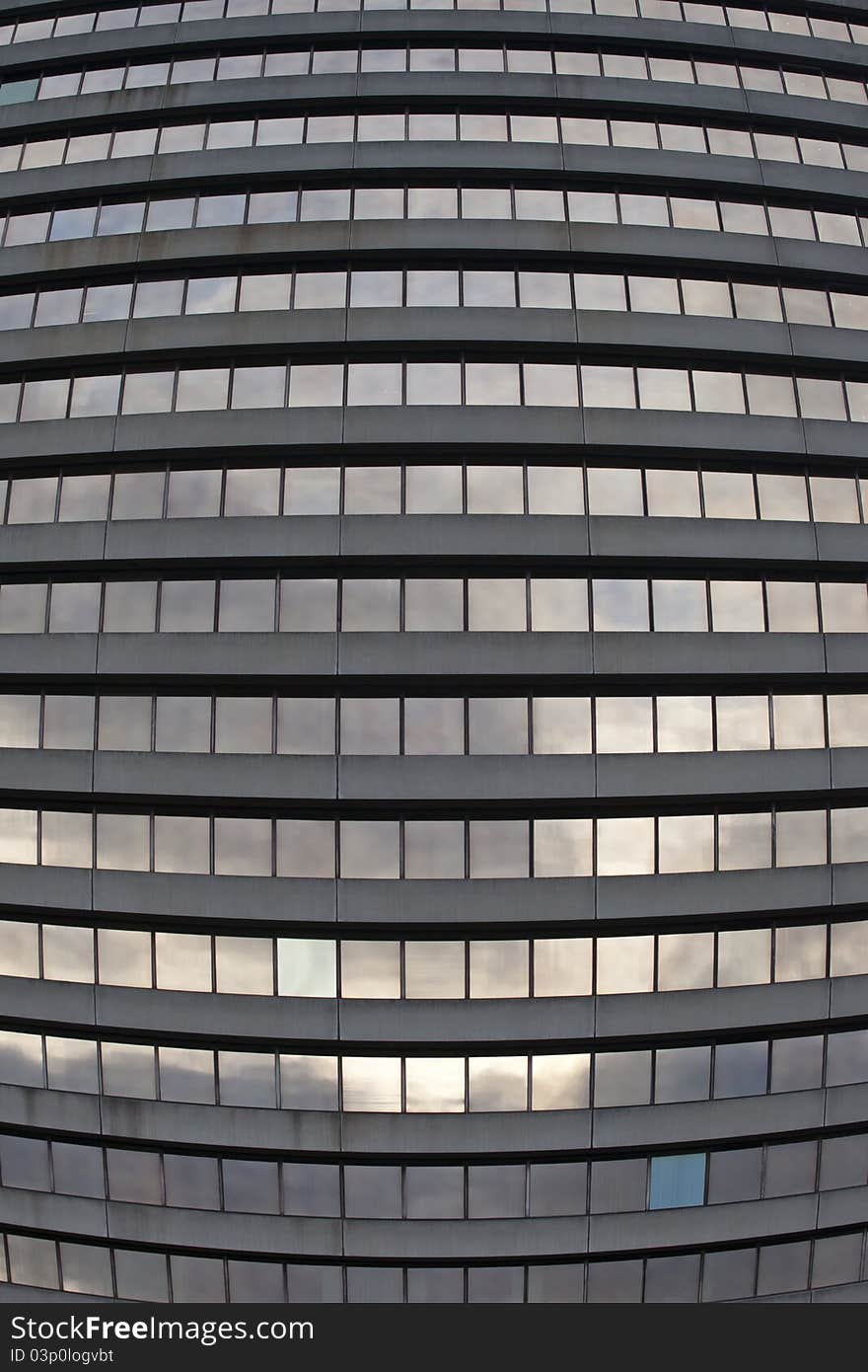 Distorted view of rows of windows in a modern office block