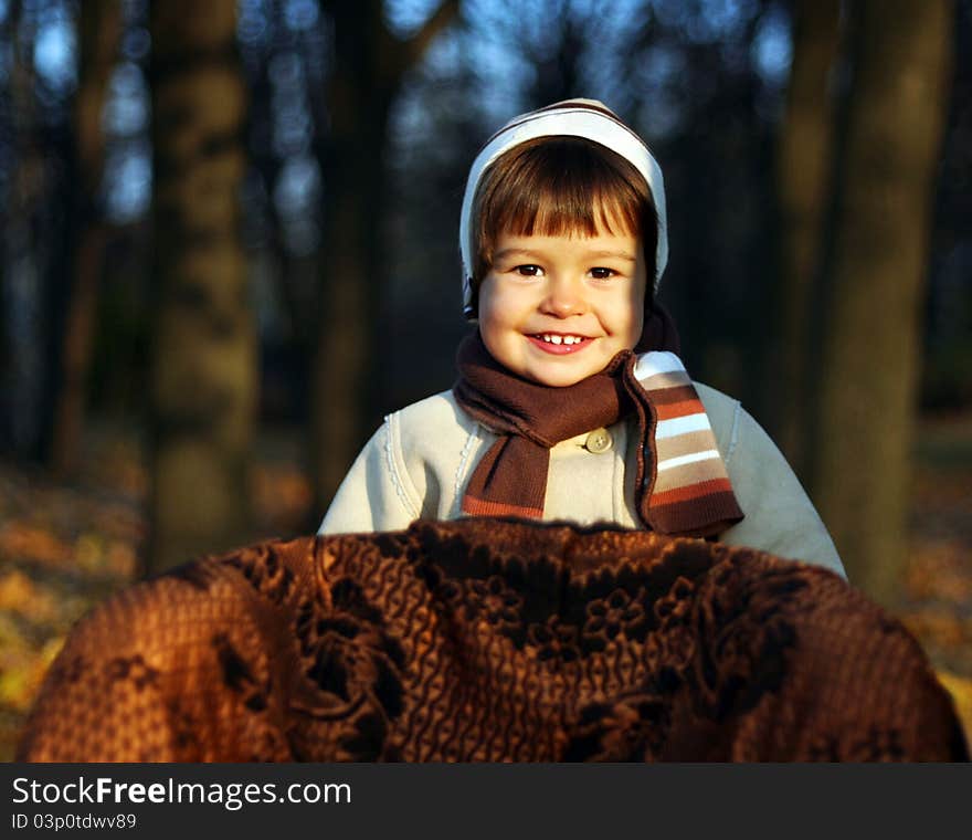 Little boy in park in autumn