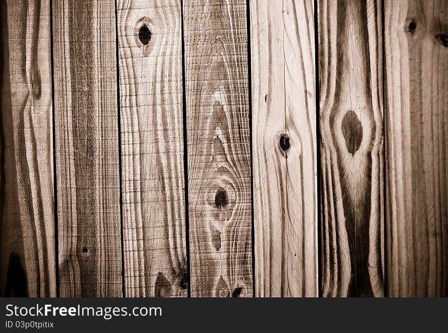 Wood grain background texture spotlit. Wood grain background texture spotlit