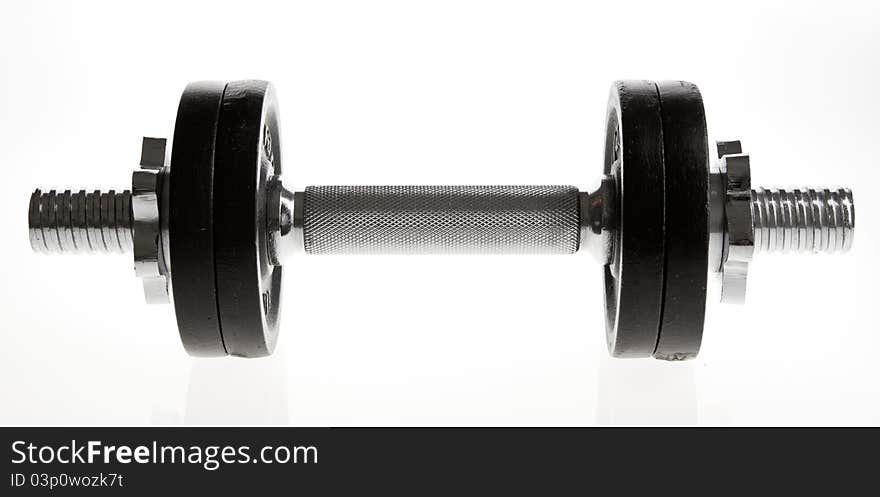 Metal dumbbell on white background. Studio shot