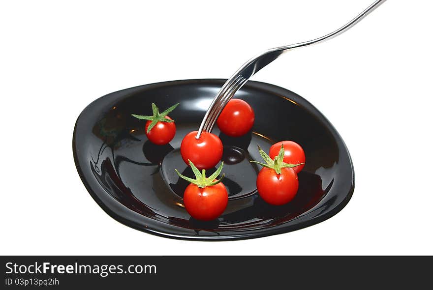 Tomatoes on the black plate