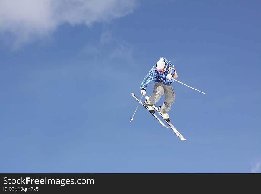 Flying skier on mountains