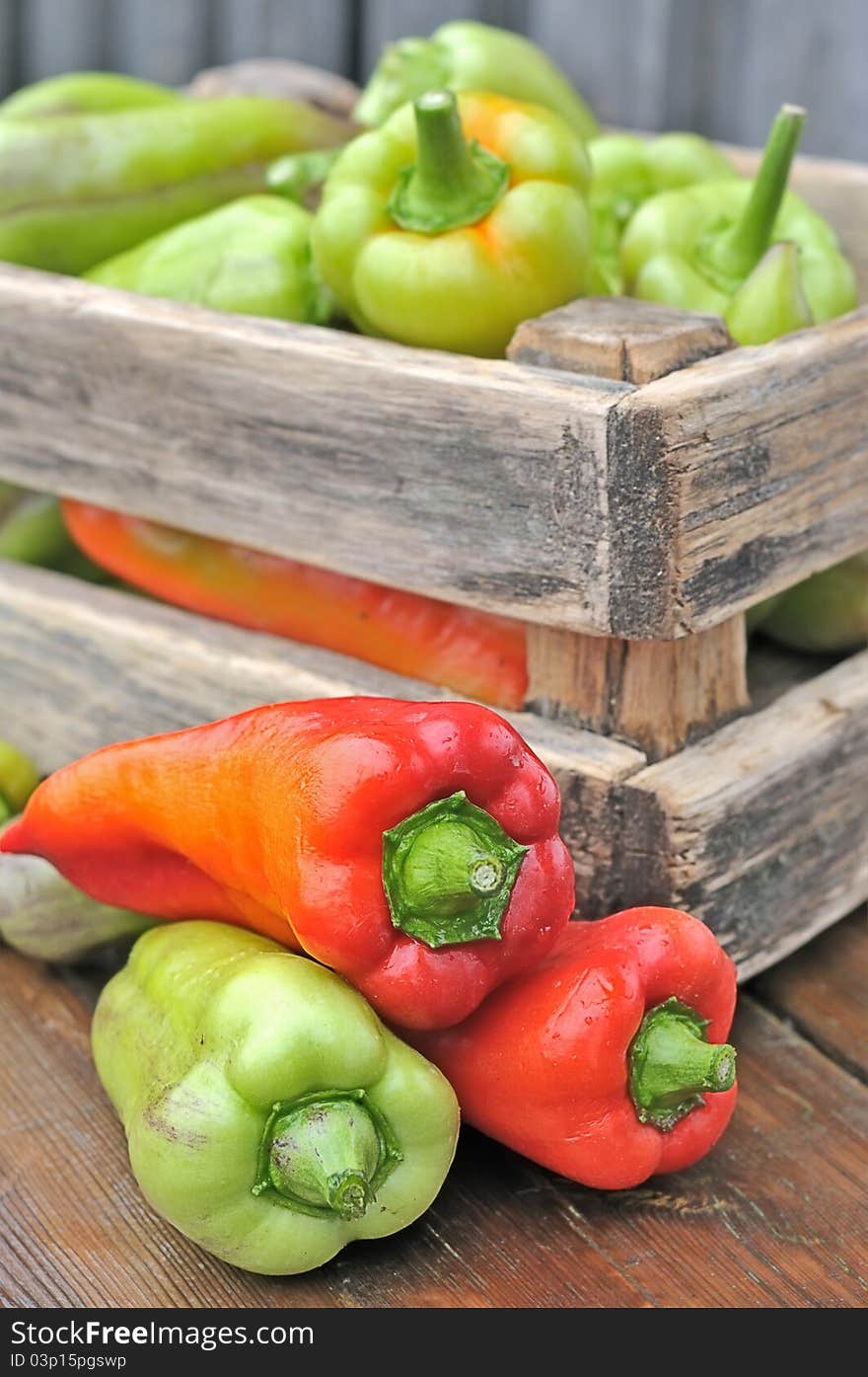 Peppers in a box on the table. Peppers in a box on the table.