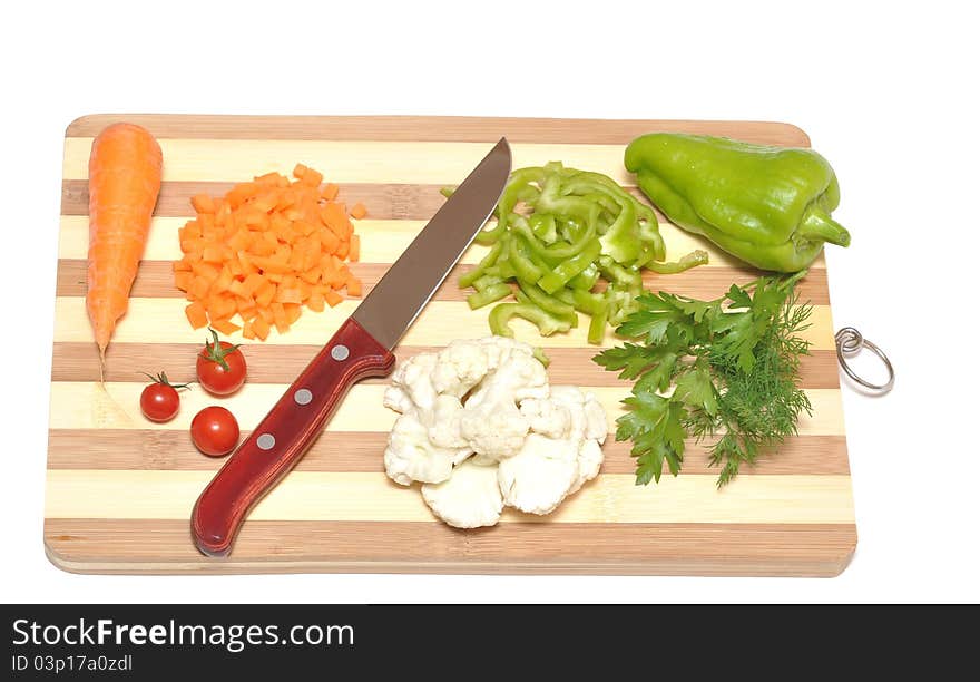 Vegetables And Kitchen-knife On Cutting Board