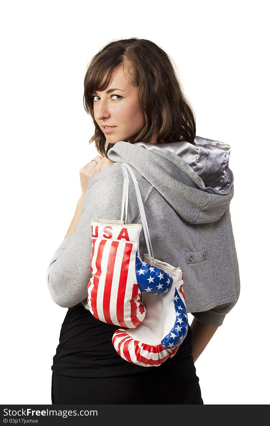 Girl posing for photo and holds boxing gloves. Girl posing for photo and holds boxing gloves