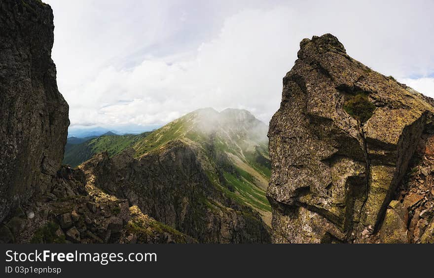 Summer mountains panorama with clouds