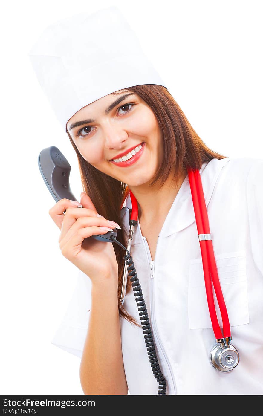 Young cute doctor takes calls on the phone