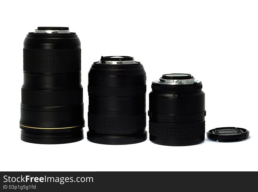 Standing photographic lenses isolated on a white background