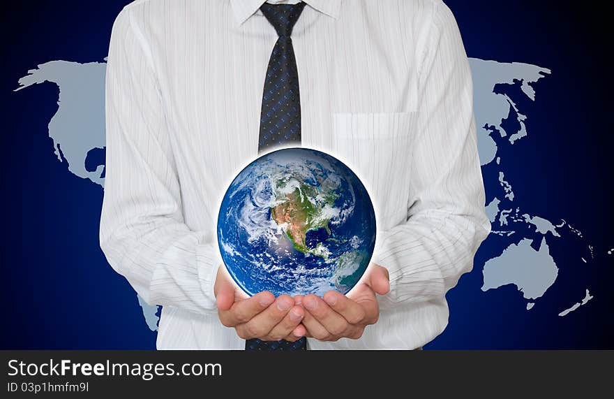 Businessman holding Planet earth with world map in background