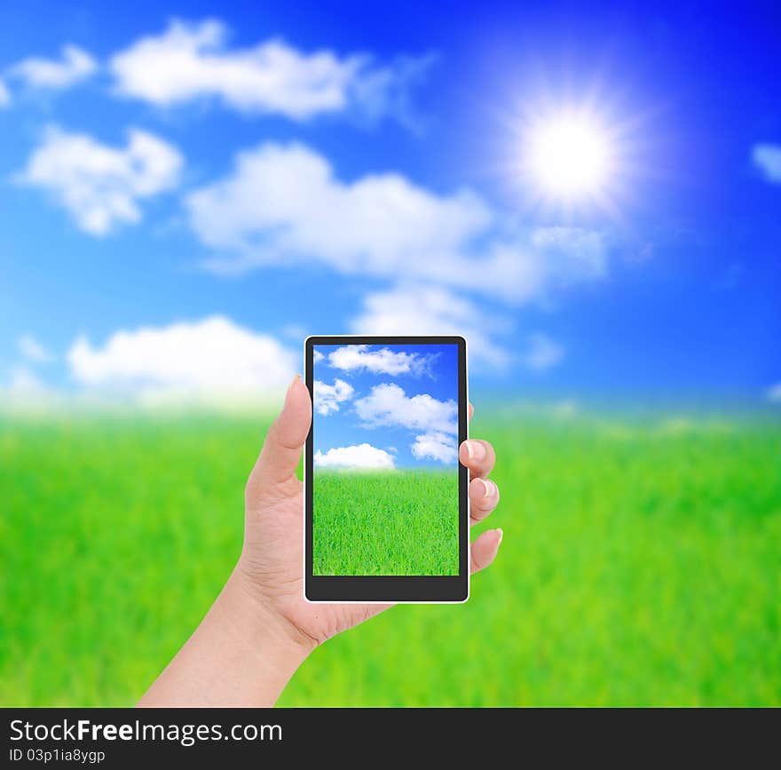 Hand to hold card, mobile phone, tablet PC on blue sky