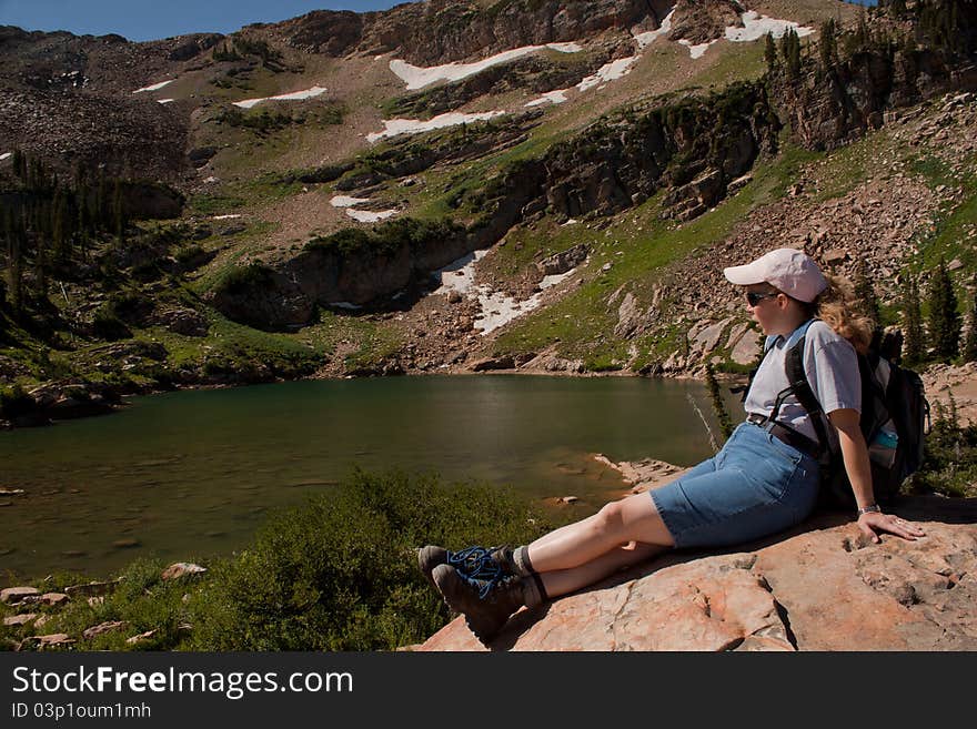 Resting hiker @ an alpine lake