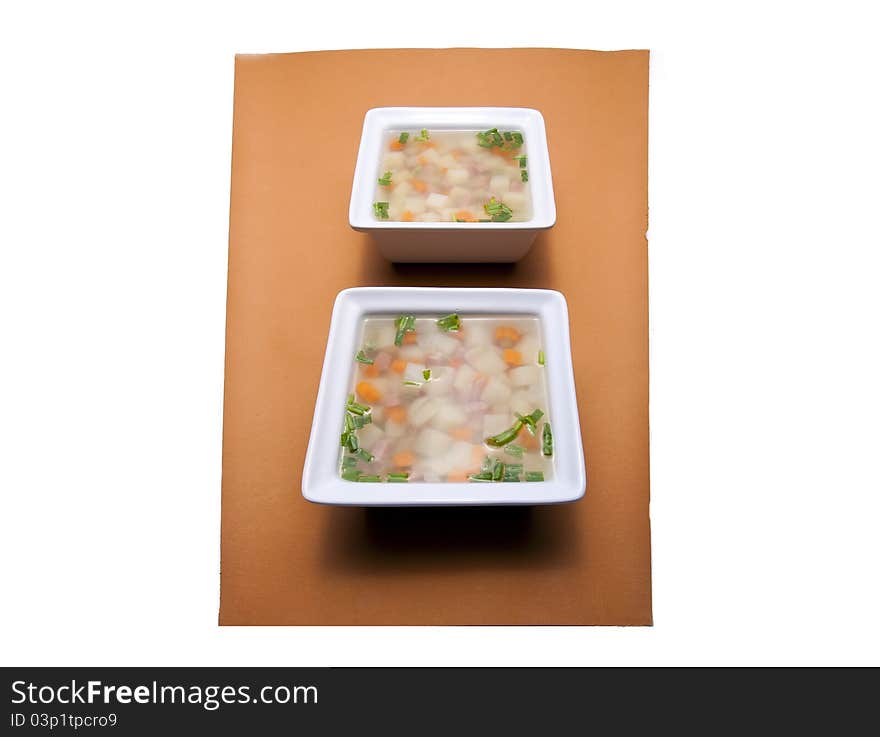 Two Square Bowls Of Soup.