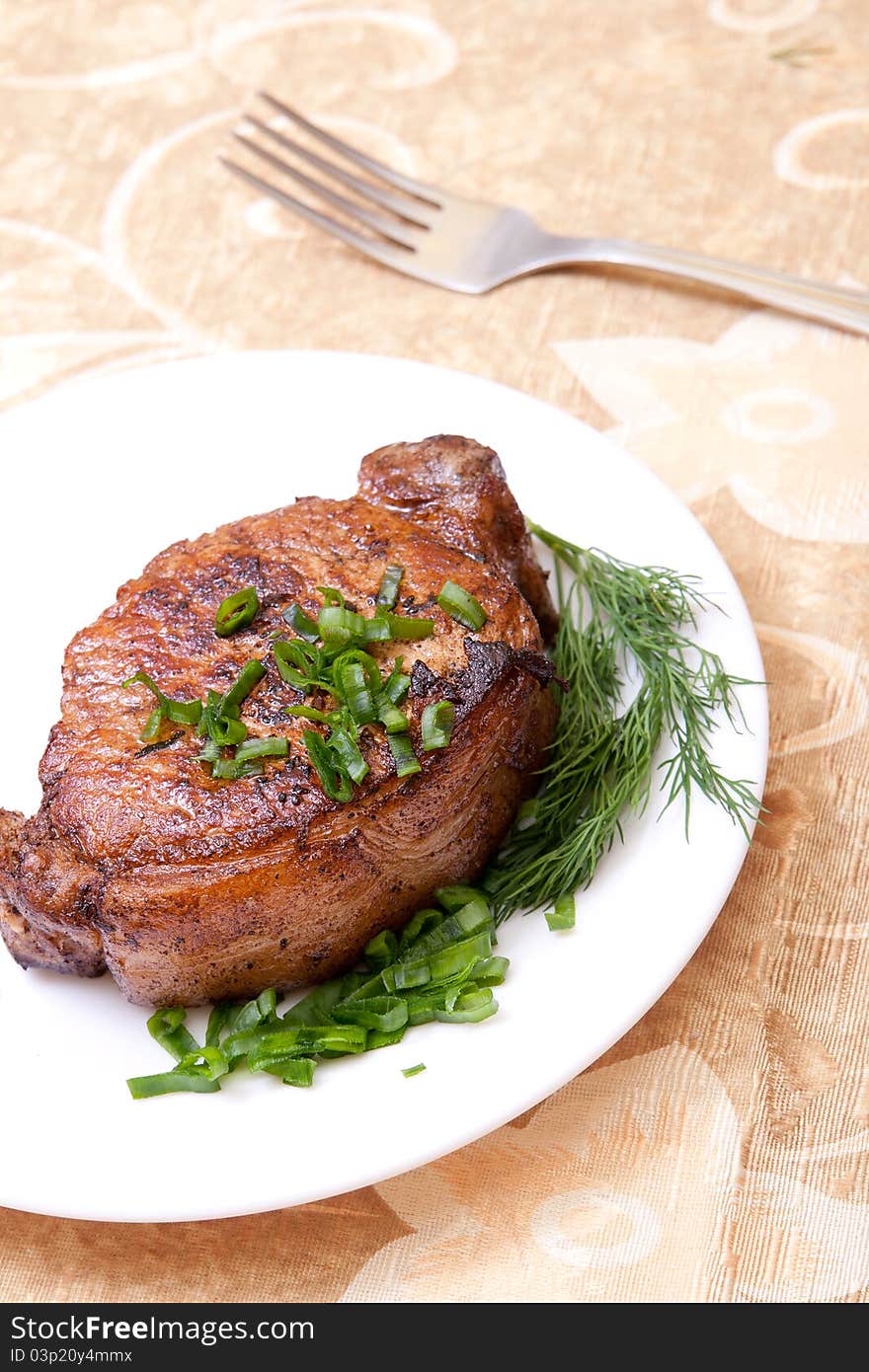 Delicious fried steak with herbs