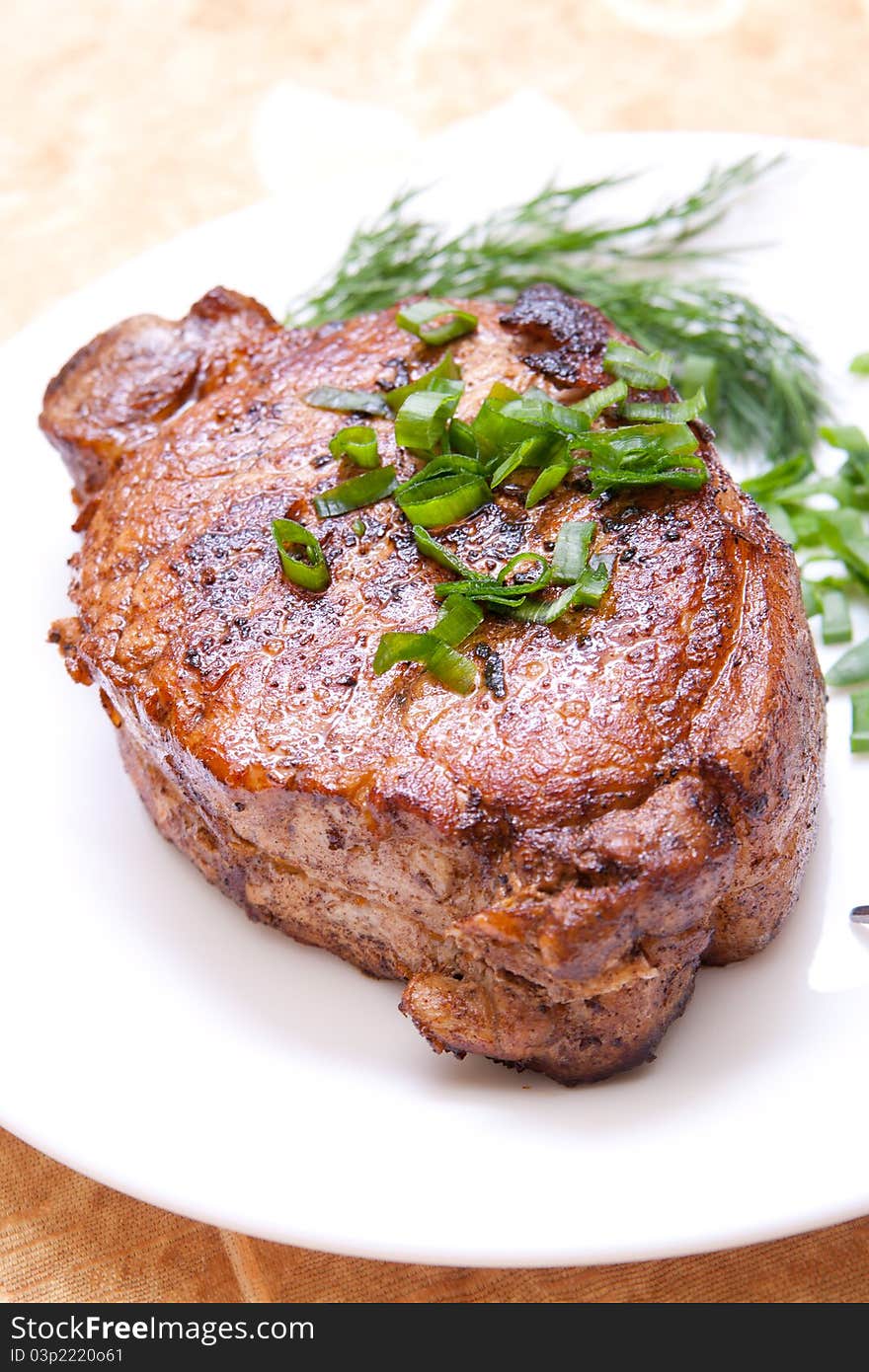 Delicious fried steak with herbs