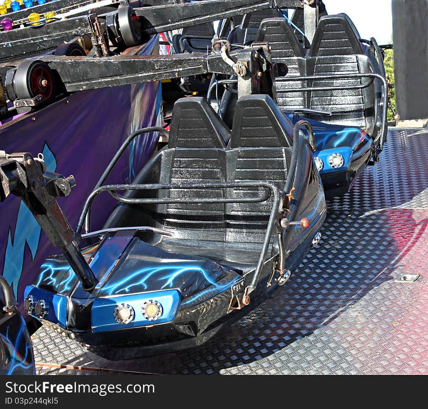 The Seats of a Fast Running Fun Fair Ride.