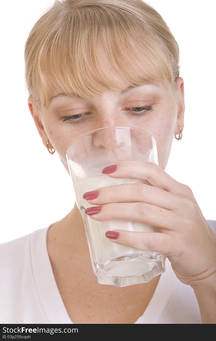 Blonde girl drinking a milk from the glass. Blonde girl drinking a milk from the glass