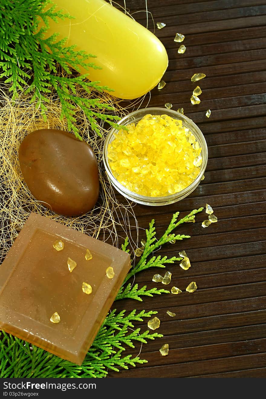 Soap, stones and bath salt on wooden