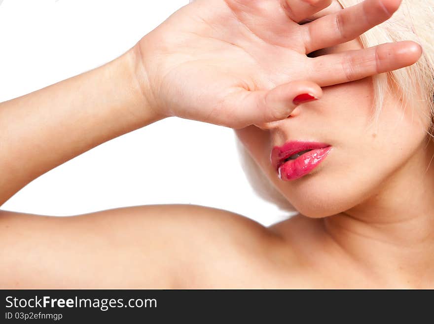 Girl is closing an eye a hand, lips dyed pink lipstick