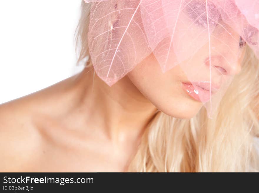 Close-up face. Pink lips. decorative pink tree leaves