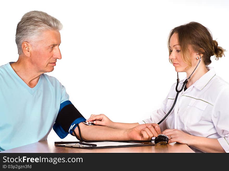 Old man with nurse sit at table on white. Old man with nurse sit at table on white