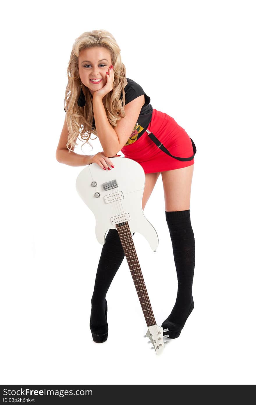 Image showing pretty blonde female posing against white with guitar. Image showing pretty blonde female posing against white with guitar