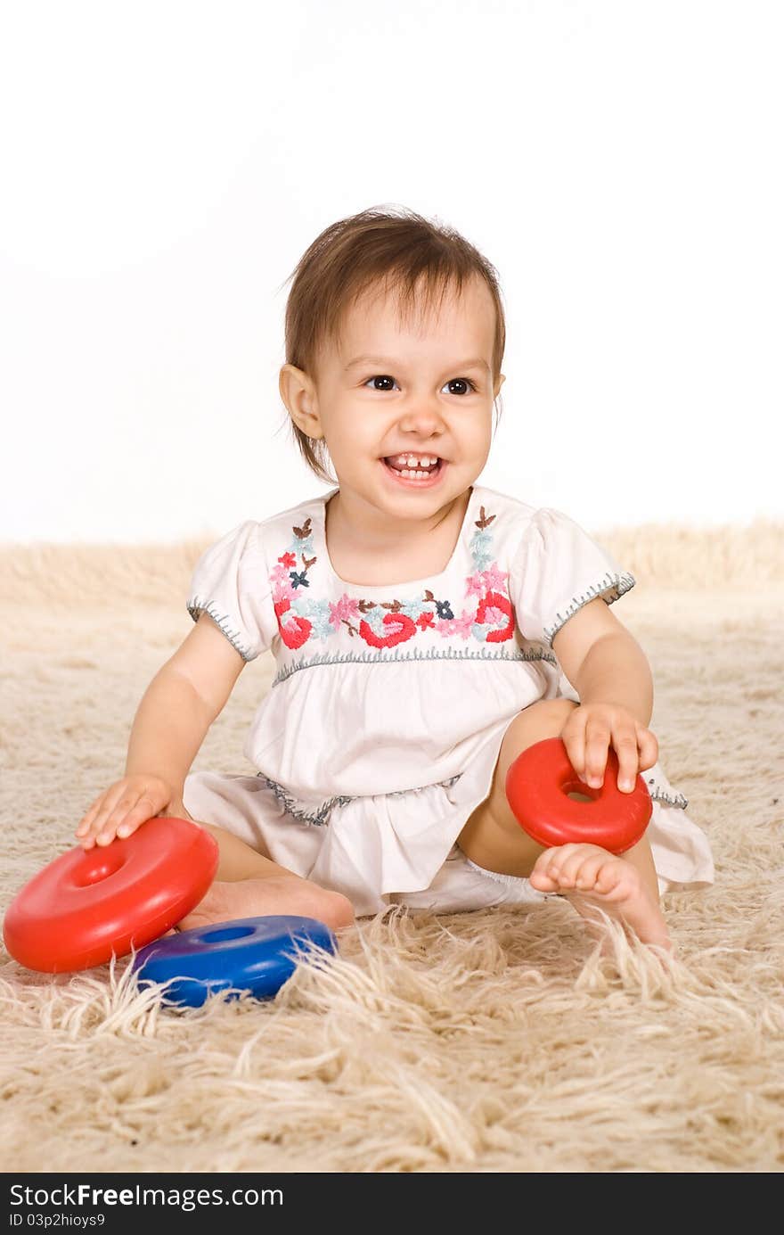 Girl Playing On Carpet