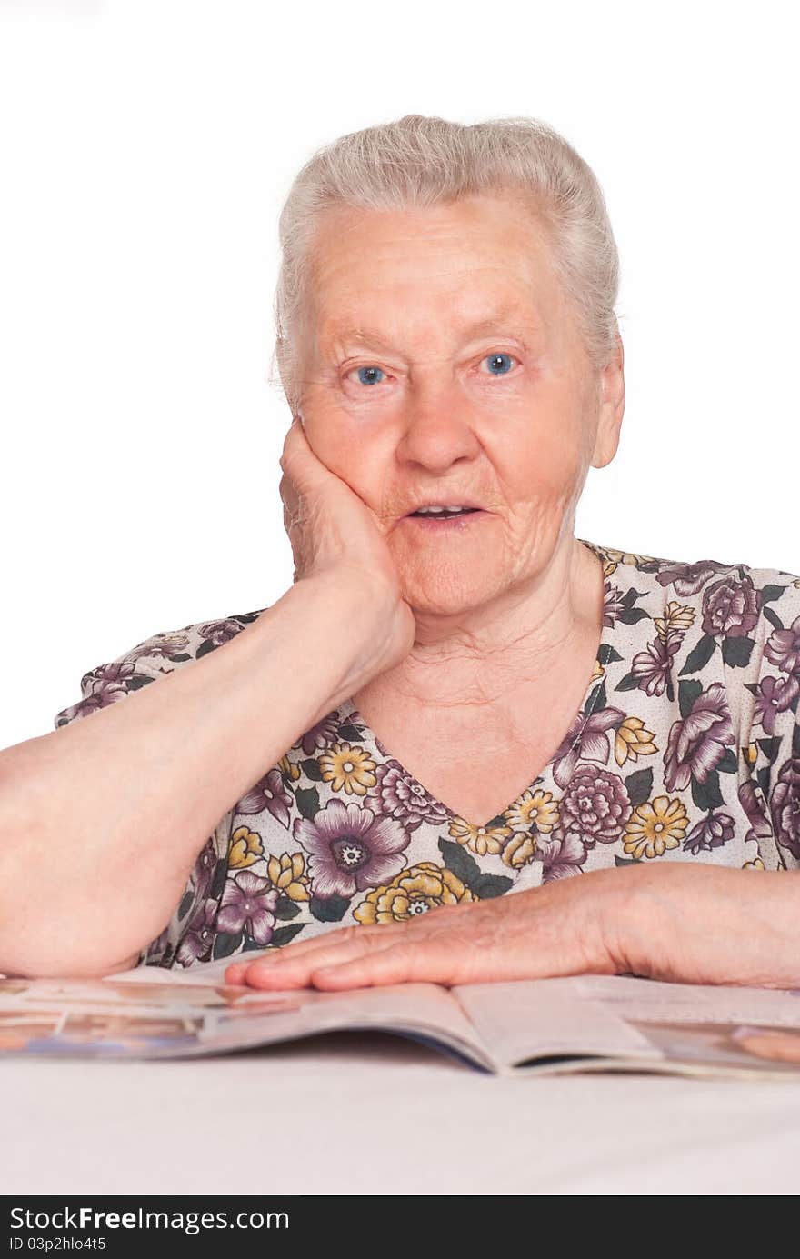 Portrait of an old woman reading a book