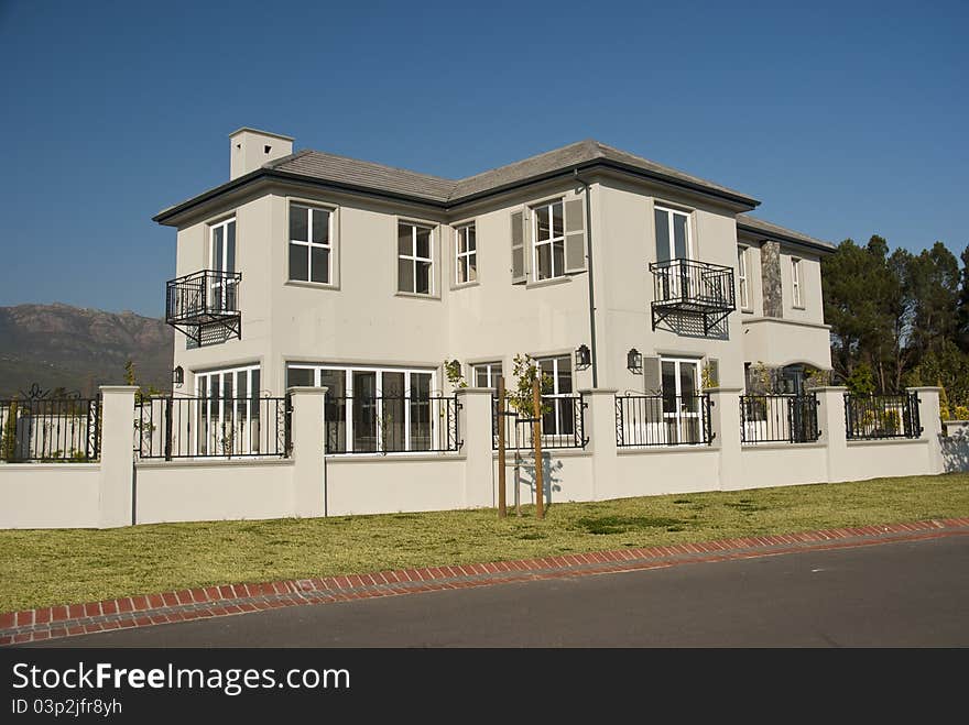 Exterior of a luxury house on a sunny day. Exterior of a luxury house on a sunny day