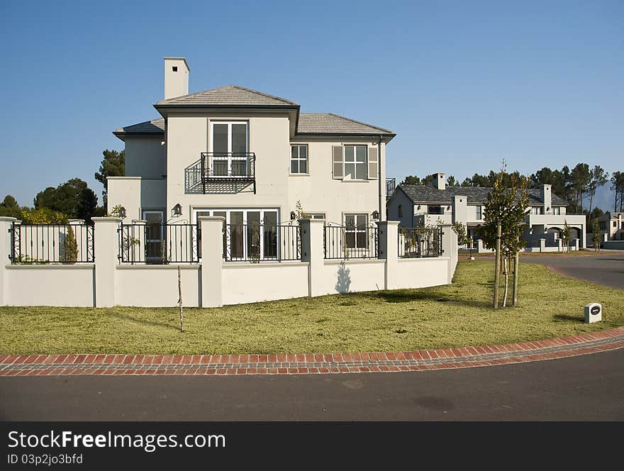 Exterior of a luxury house on a sunny day. Exterior of a luxury house on a sunny day