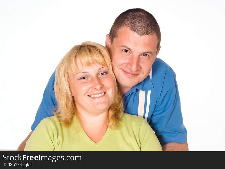 Portrait of a cute couple on a white. Portrait of a cute couple on a white