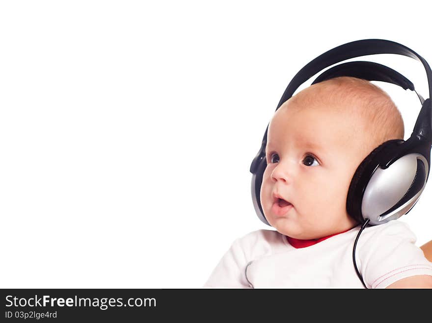 Cute little baby with headphones on white