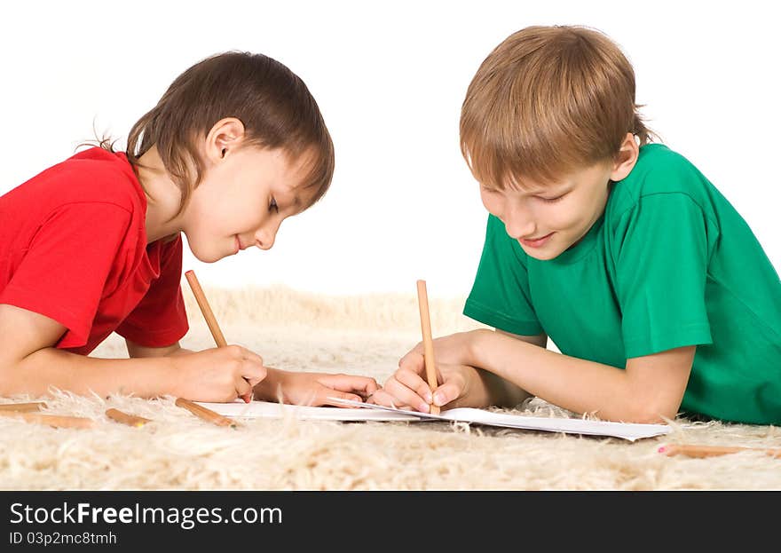 Portrait of a two boys drawing on carpet. Portrait of a two boys drawing on carpet