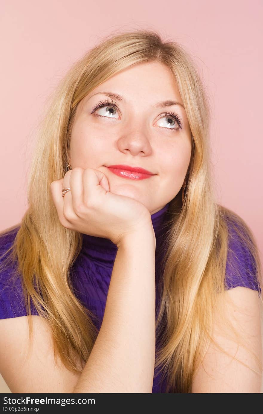 Cute girl posing on a pink background. Cute girl posing on a pink background