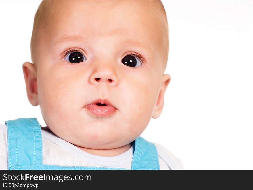 Portrait of a cute baby posing on a white. Portrait of a cute baby posing on a white