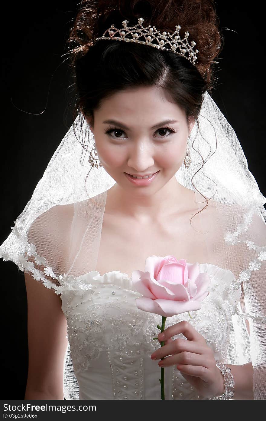 Portrait of beautiful girl with flower on her face