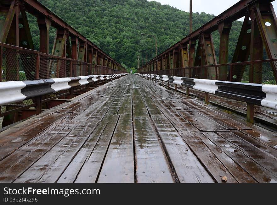 Outdated wooden bridge over the river. Outdated wooden bridge over the river