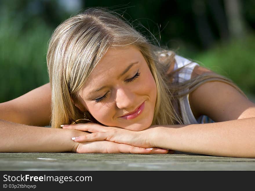 Beautiful girl on the pier on the lake. Beautiful girl on the pier on the lake