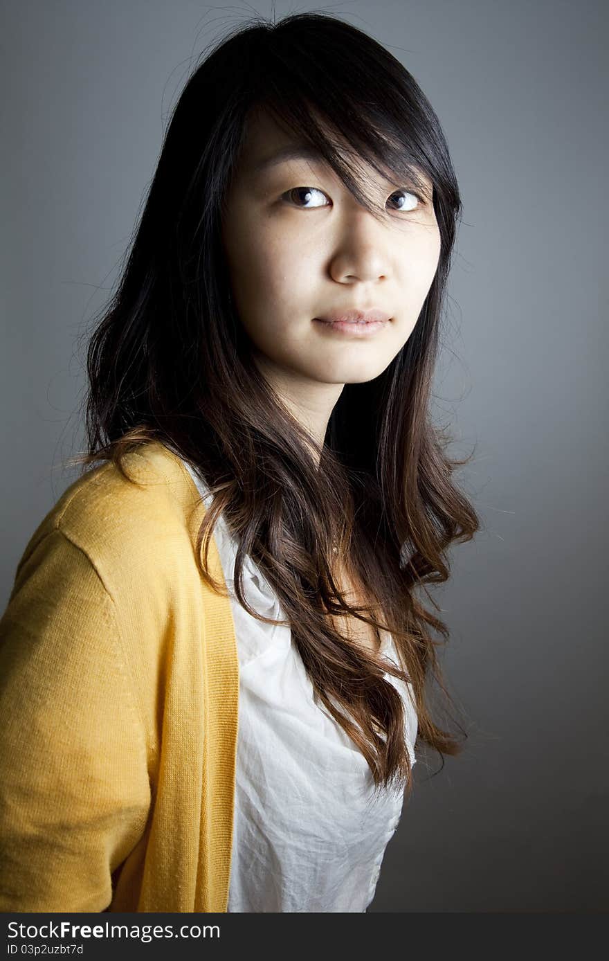 Portrait of a young Asia girl looking at the camera. Portrait of a young Asia girl looking at the camera.