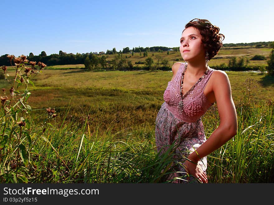 Beautiful Girl In Dress On Field