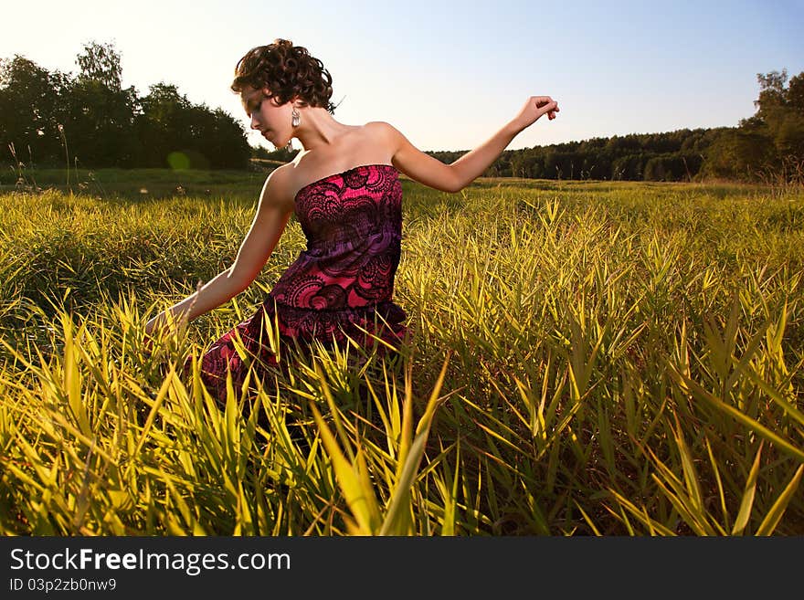 Beautiful Girl In Dress On Field