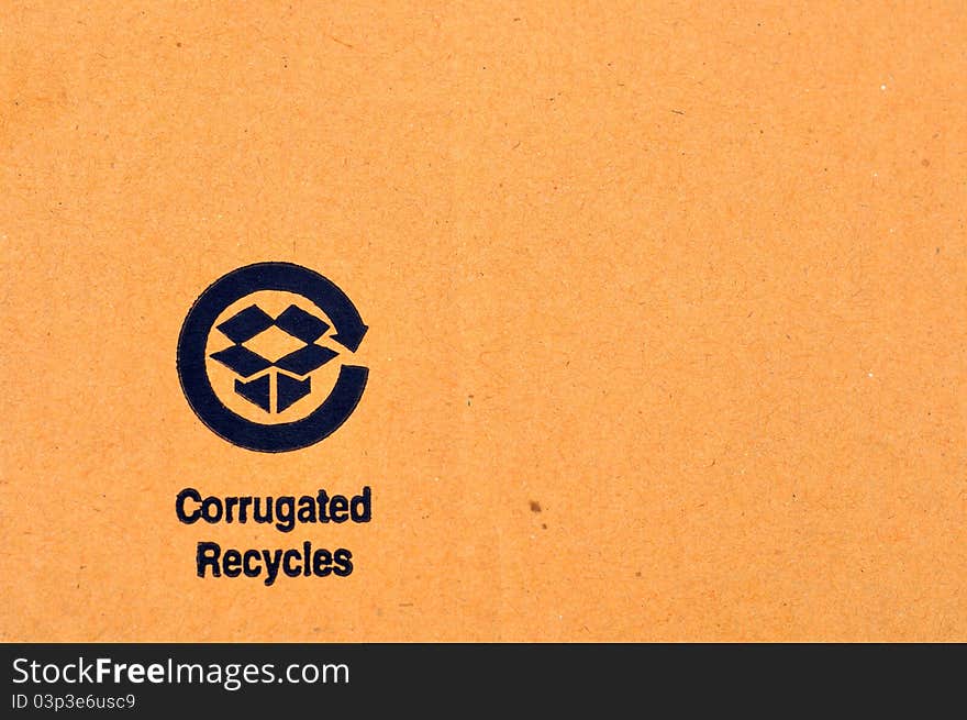 Closeup of a recycle label on a cardboard box