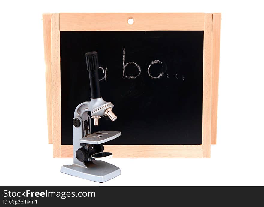 School board with a microscope on a white background