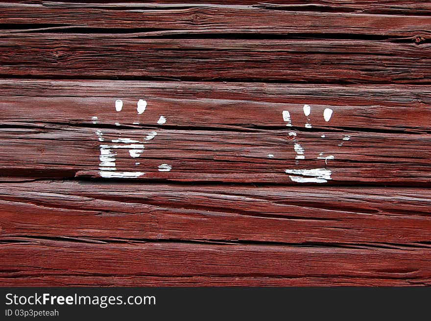 White hands imprint on red wall