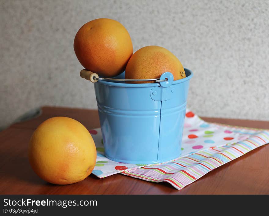 Grapefruit in a bucket