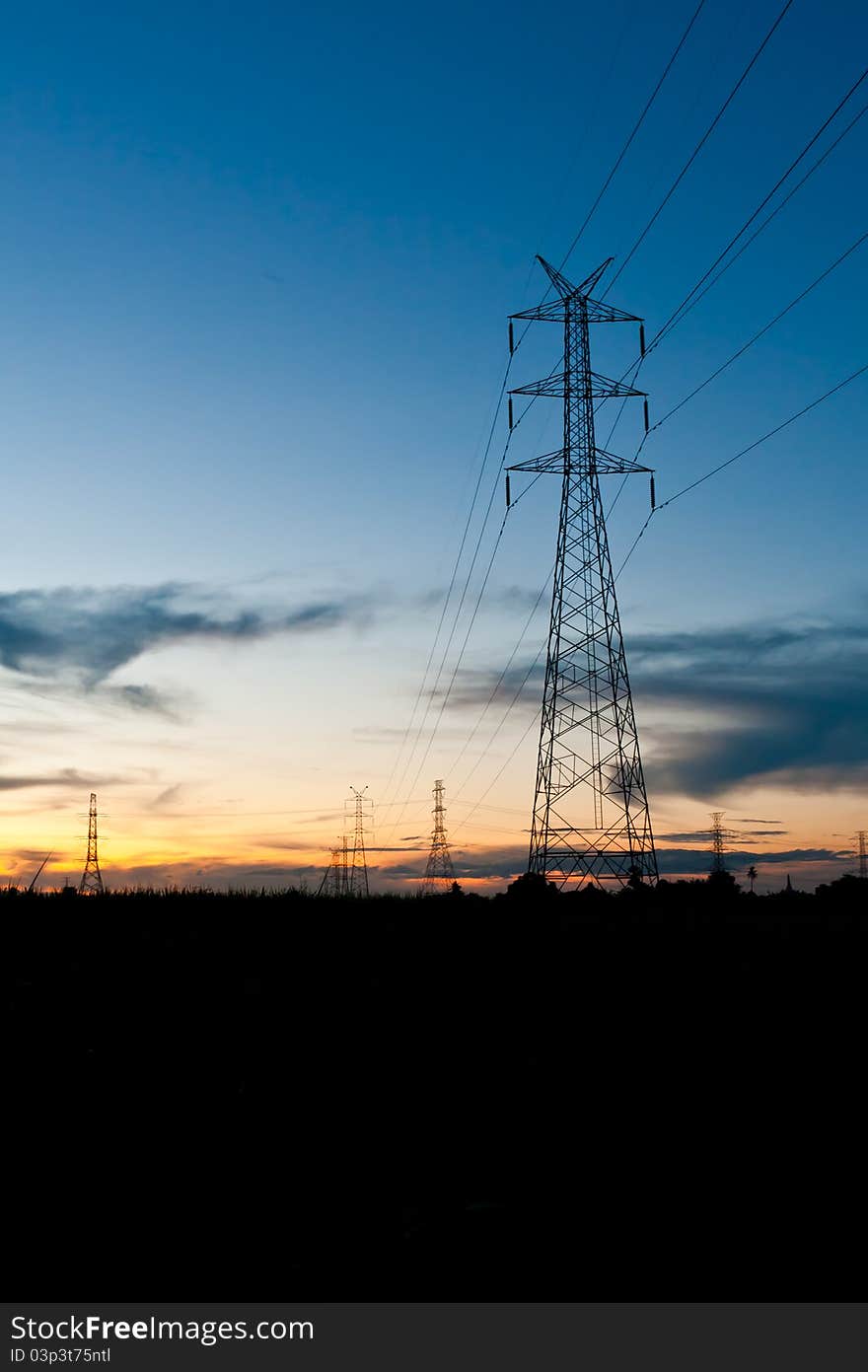 Electricity poles in twilight time in rural place