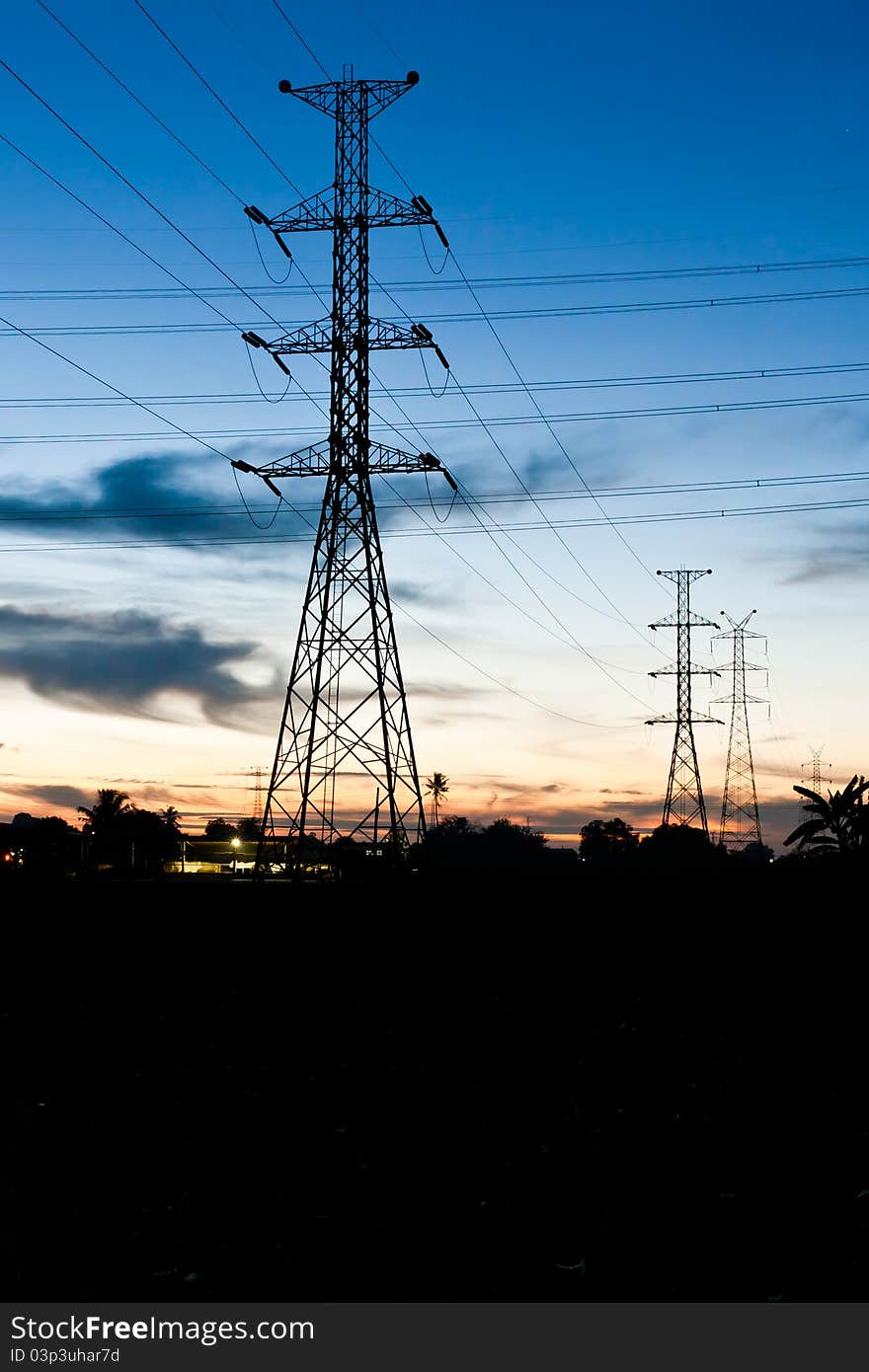 Electricity poles in twilight time in rural place