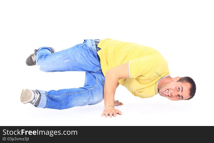 Young handsome fresh man breakdancing with stylish clothes.