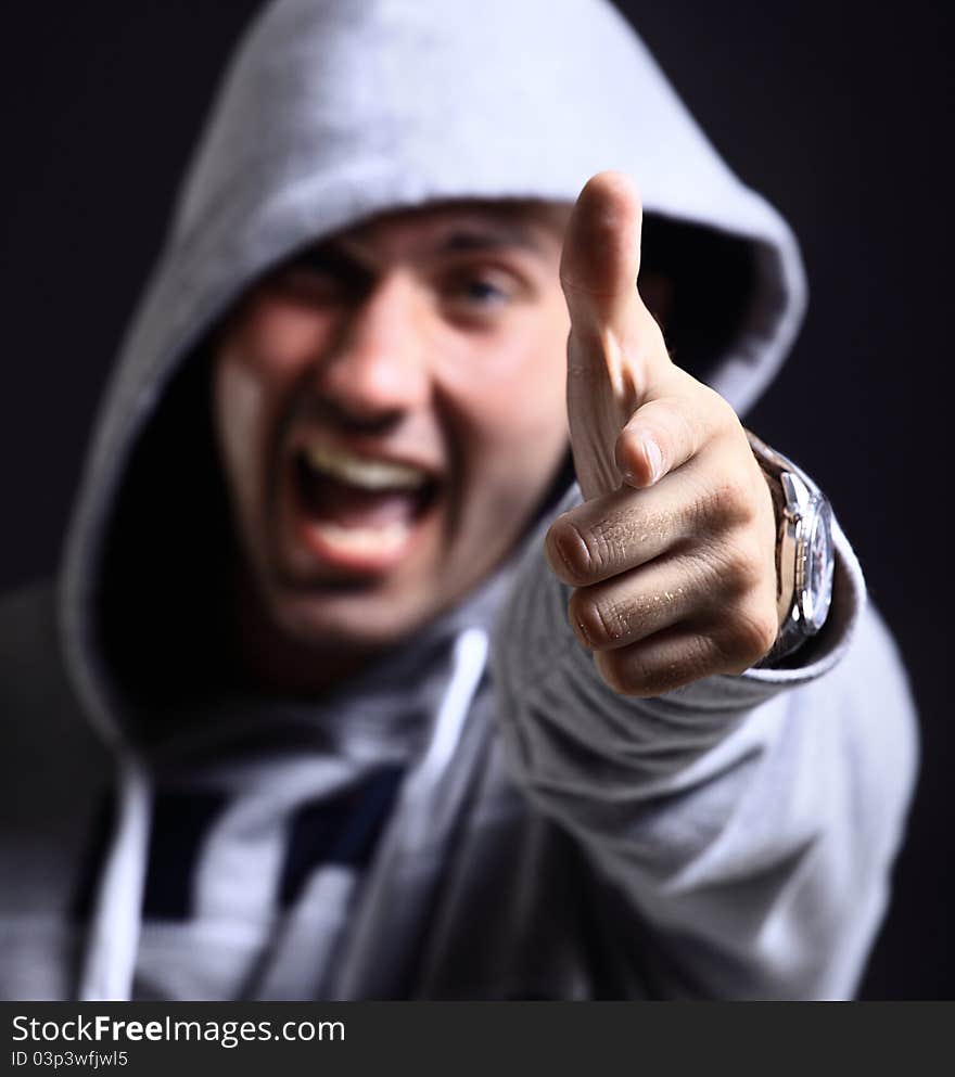 Cool b-boy in light jacket against black background. Cool b-boy in light jacket against black background