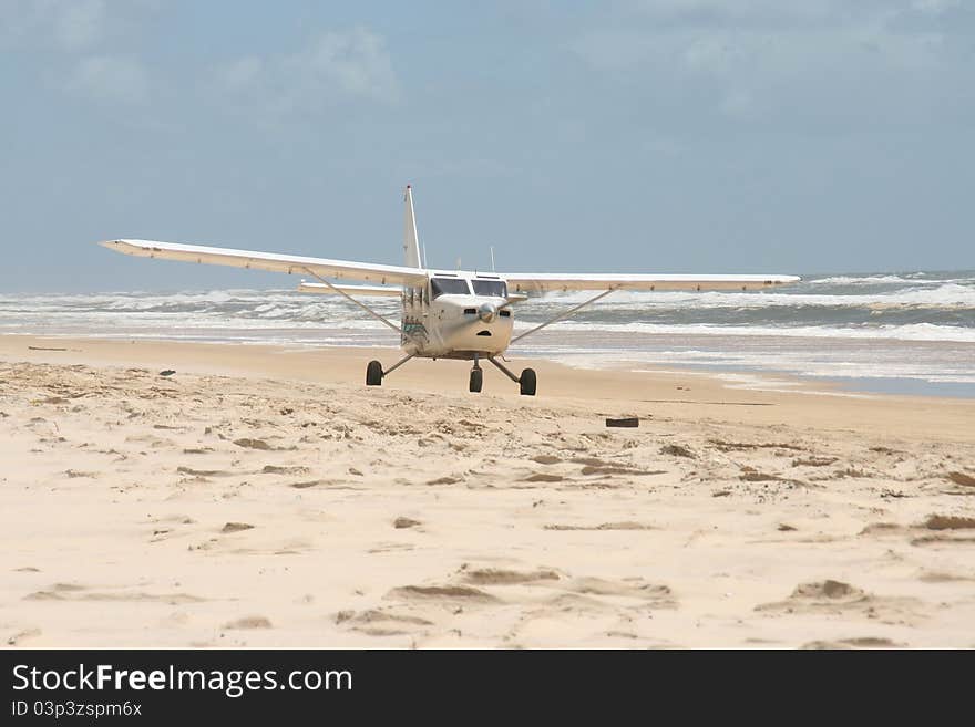 Gipps airvan landing on beach in Fraser Island. Gipps airvan landing on beach in Fraser Island